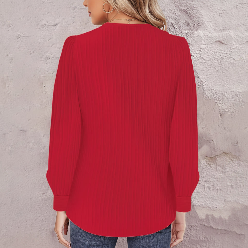 Asymmetrische Bluse mit Rippenstruktur und Puffärmeln am Hals