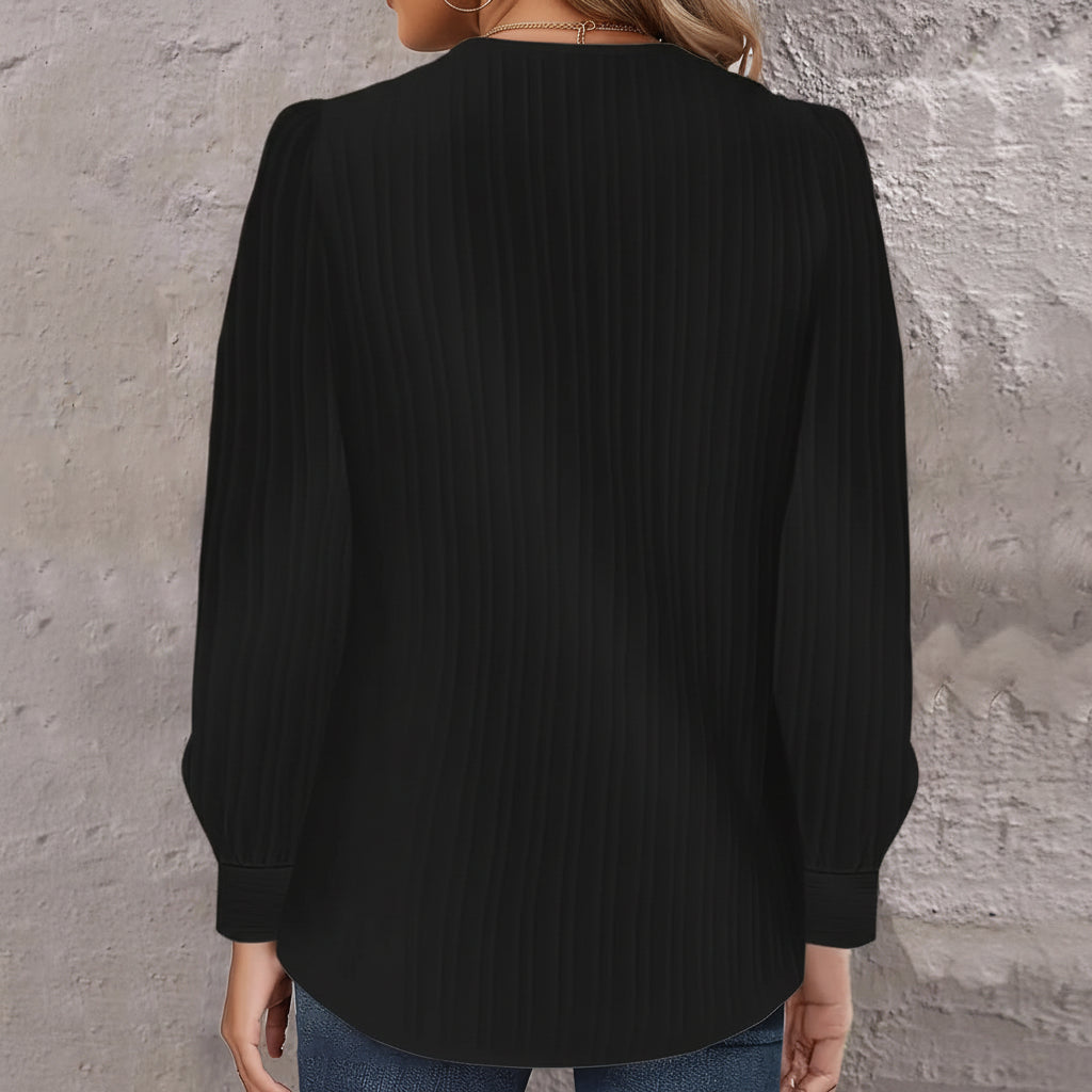 Asymmetrische Bluse mit Rippenstruktur und Puffärmeln am Hals