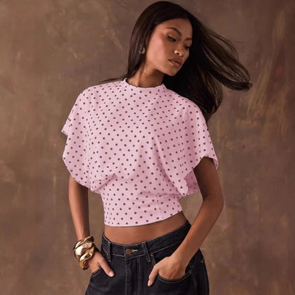 Top corto a pois elegante con maniche a pipistrello per uno stile femminile
