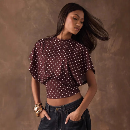 Top corto a pois elegante con maniche a pipistrello per uno stile femminile
