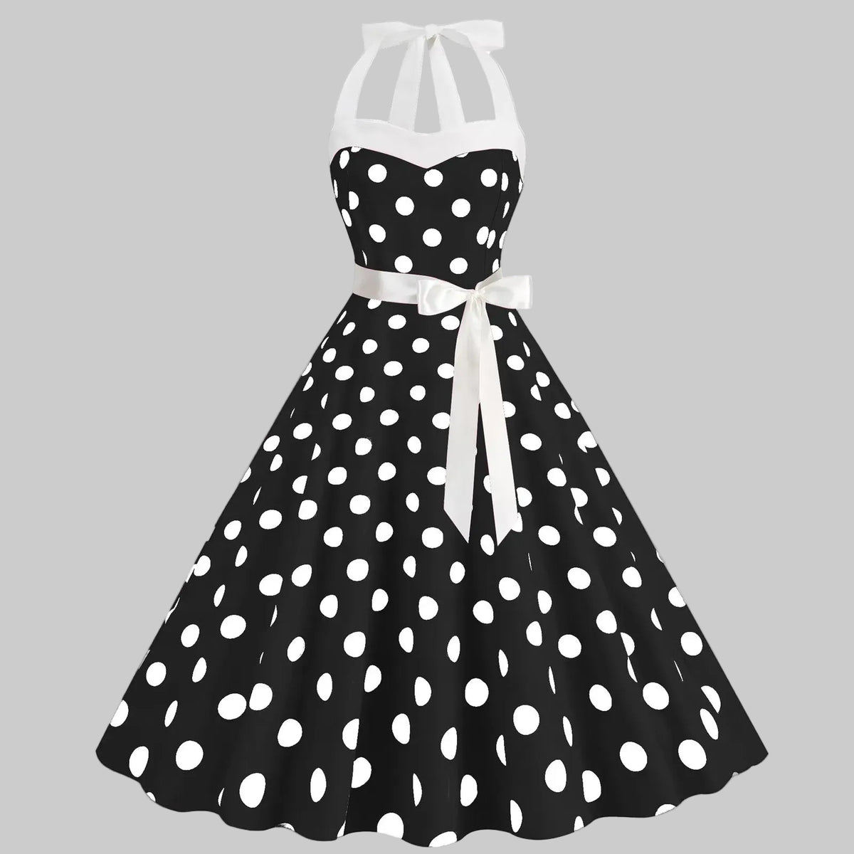 Elegantes gepunktetes Kleid mit voluminösem Rock und weitem Saum